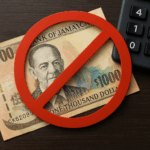 Jamaican $1000 note crossed out with a red “no” symbol beside a calculator